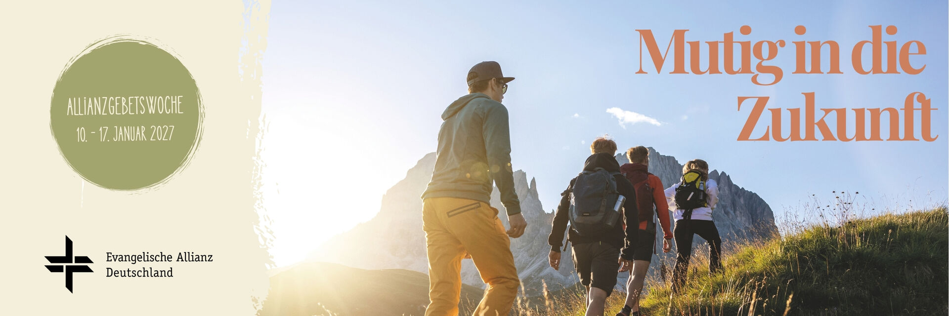 Eine Gruppe von Menschen wandert in einer bergigen Landschaft. Der Text "Mutig in die Zukunft" und Informationen zur Allianzgebetswoche (10. - 17. Januar 2027) sind sichtbar. (Text KI generiert)